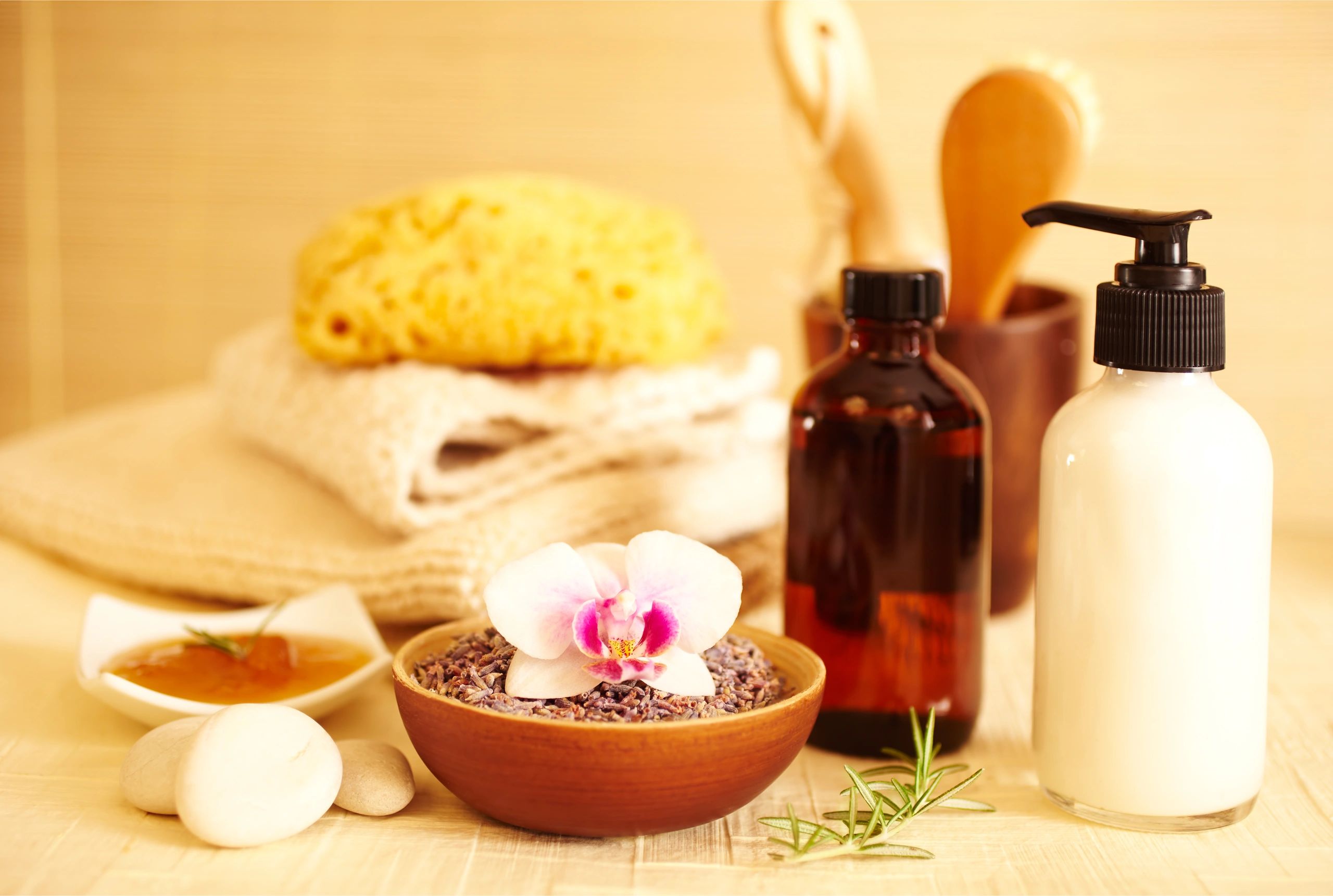 Spa products and towels representing full body massage wellness