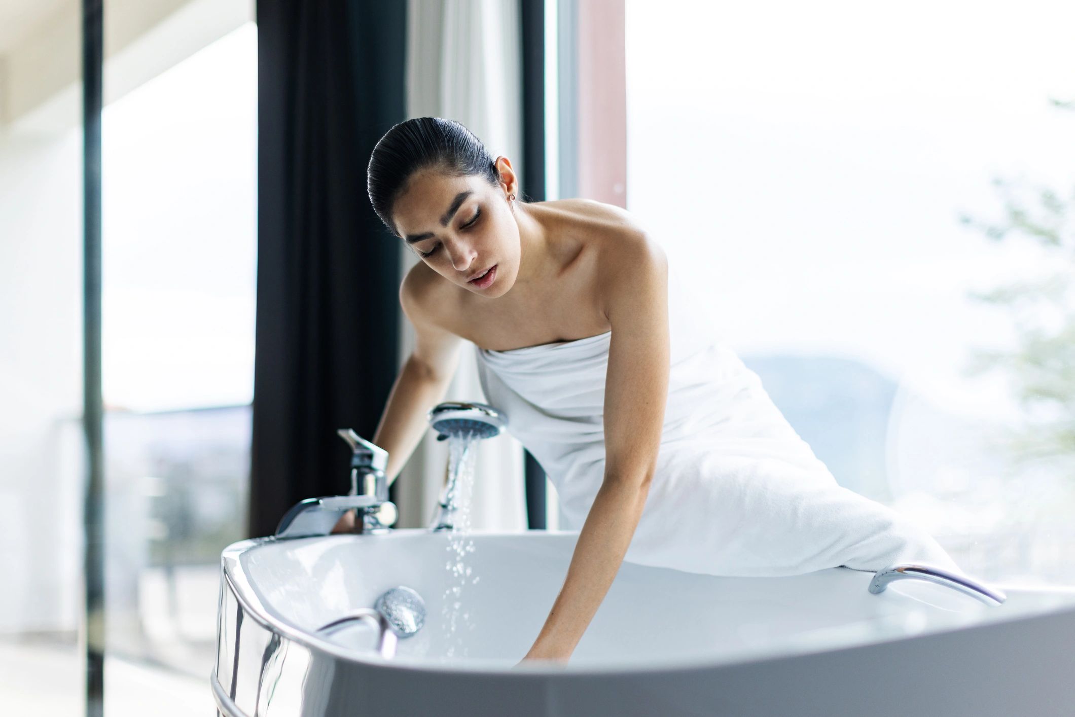 Relaxed woman enjoying a peaceful self-care moment at home