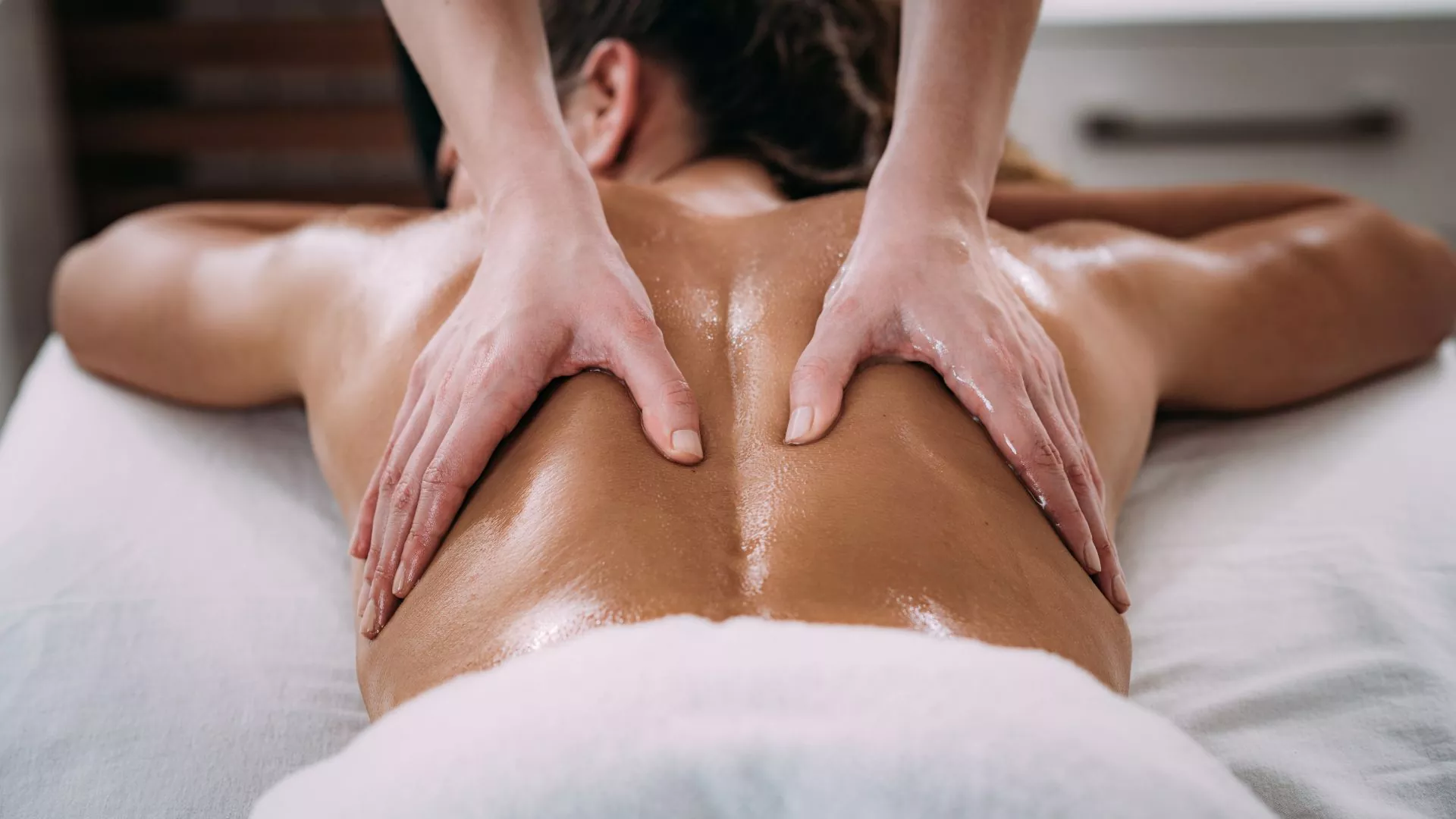 Deep tissue massage focused on the upper back and shoulders